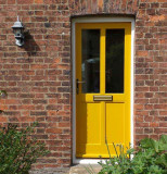 Yellow hardwood door in North Norfolk